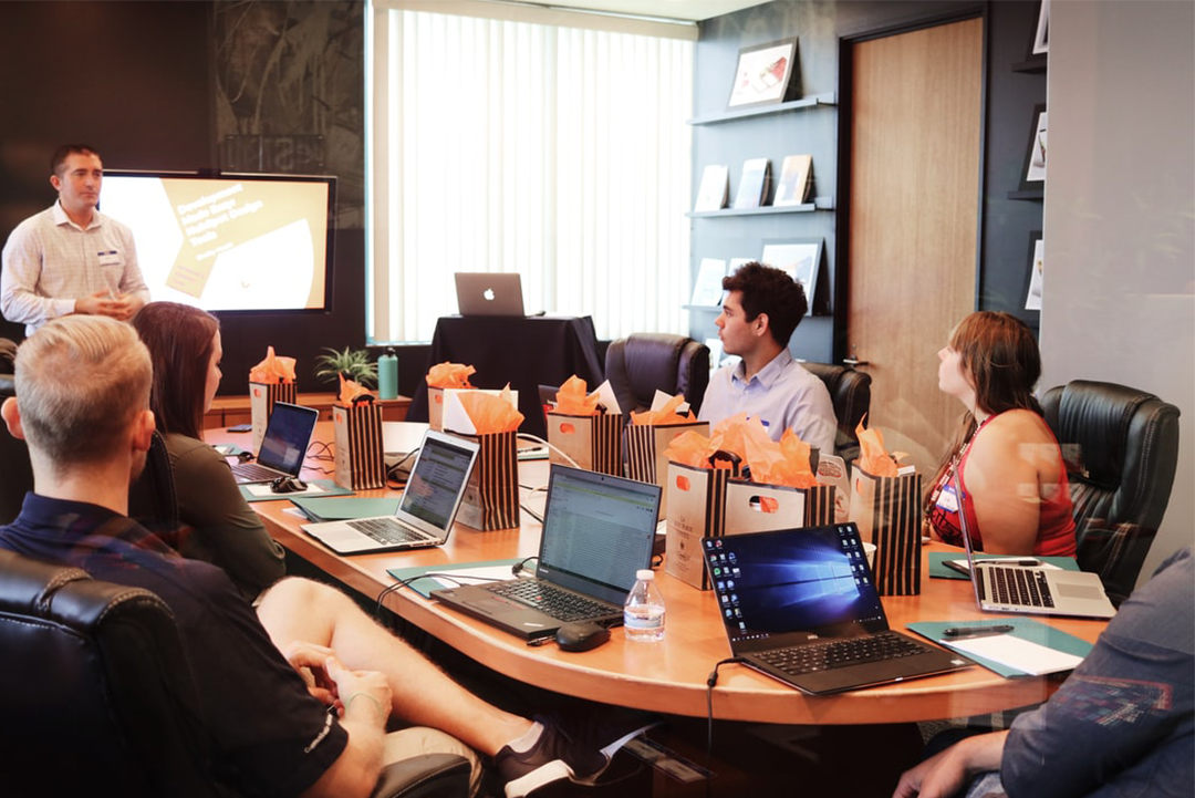 Team of employees on their laptops.