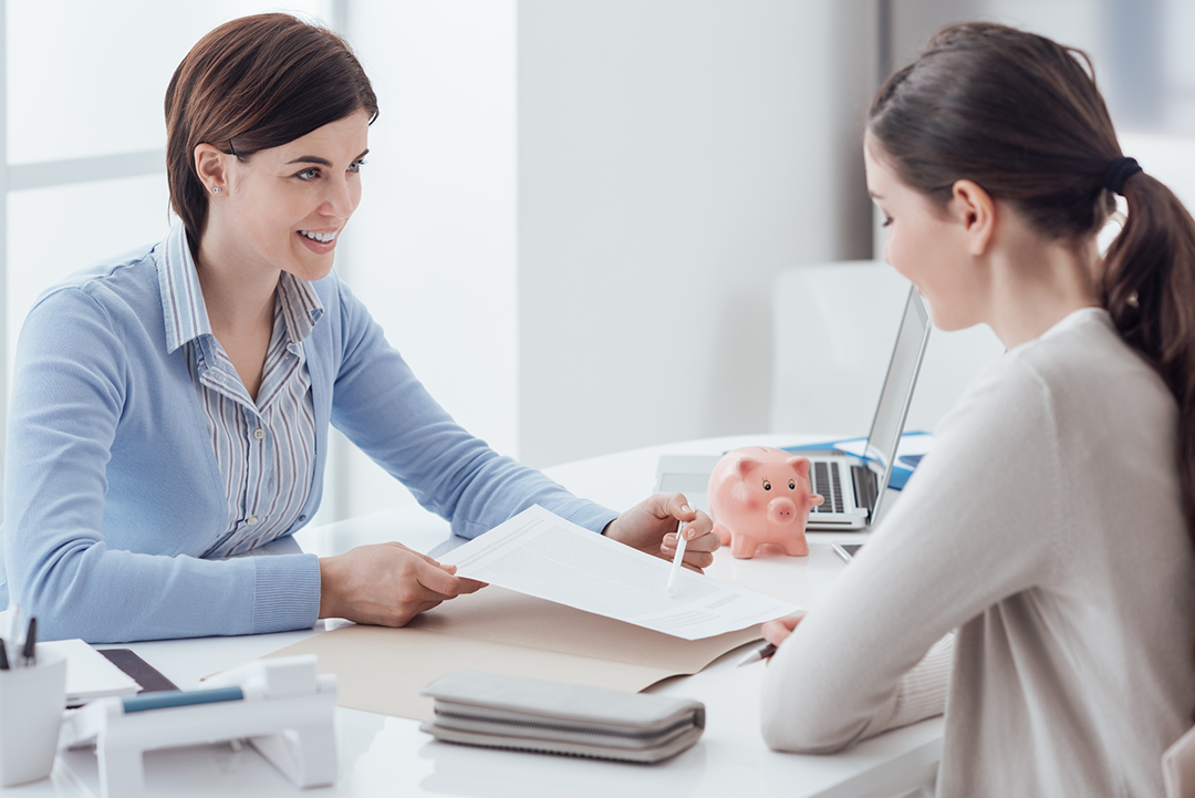 Two people talking in an office.